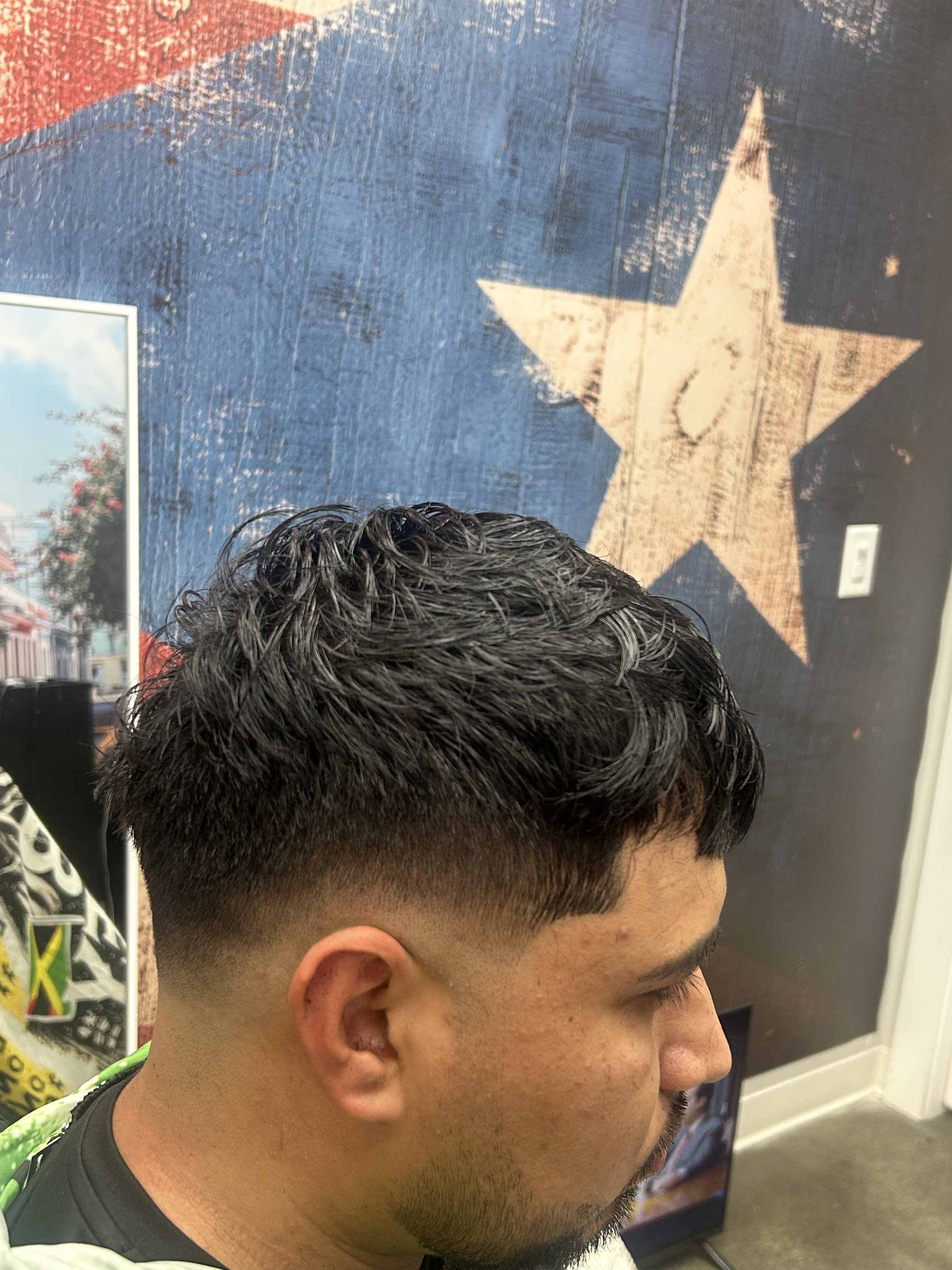 Textured top with a low taper fade