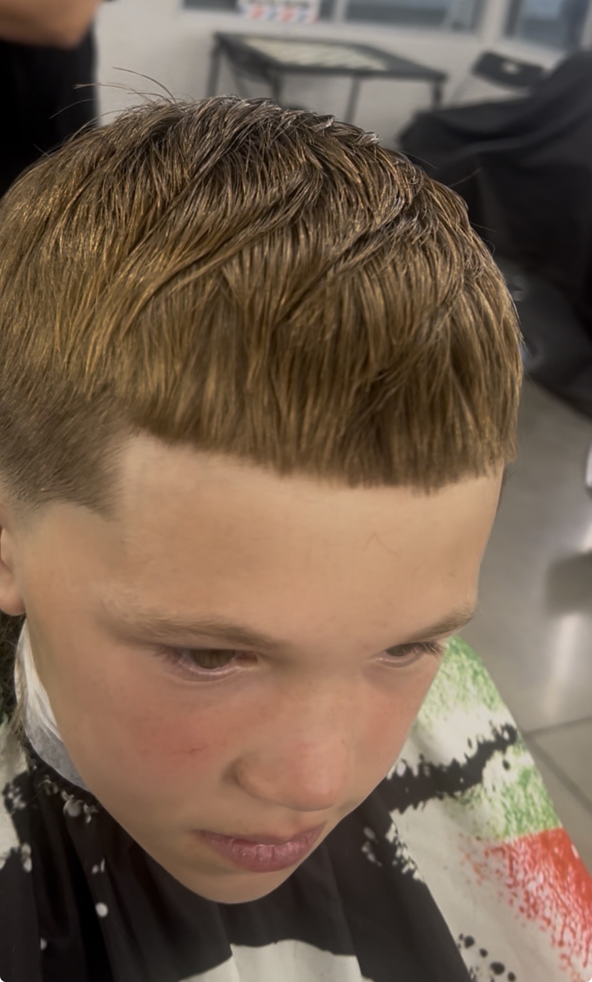 Sharp fringe cut on a kid